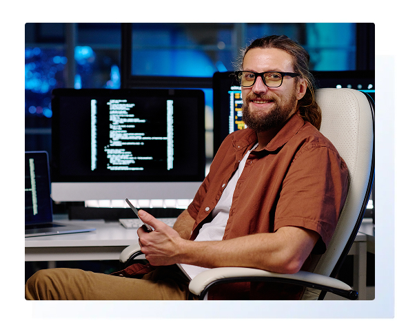 employee siting in front of a computer